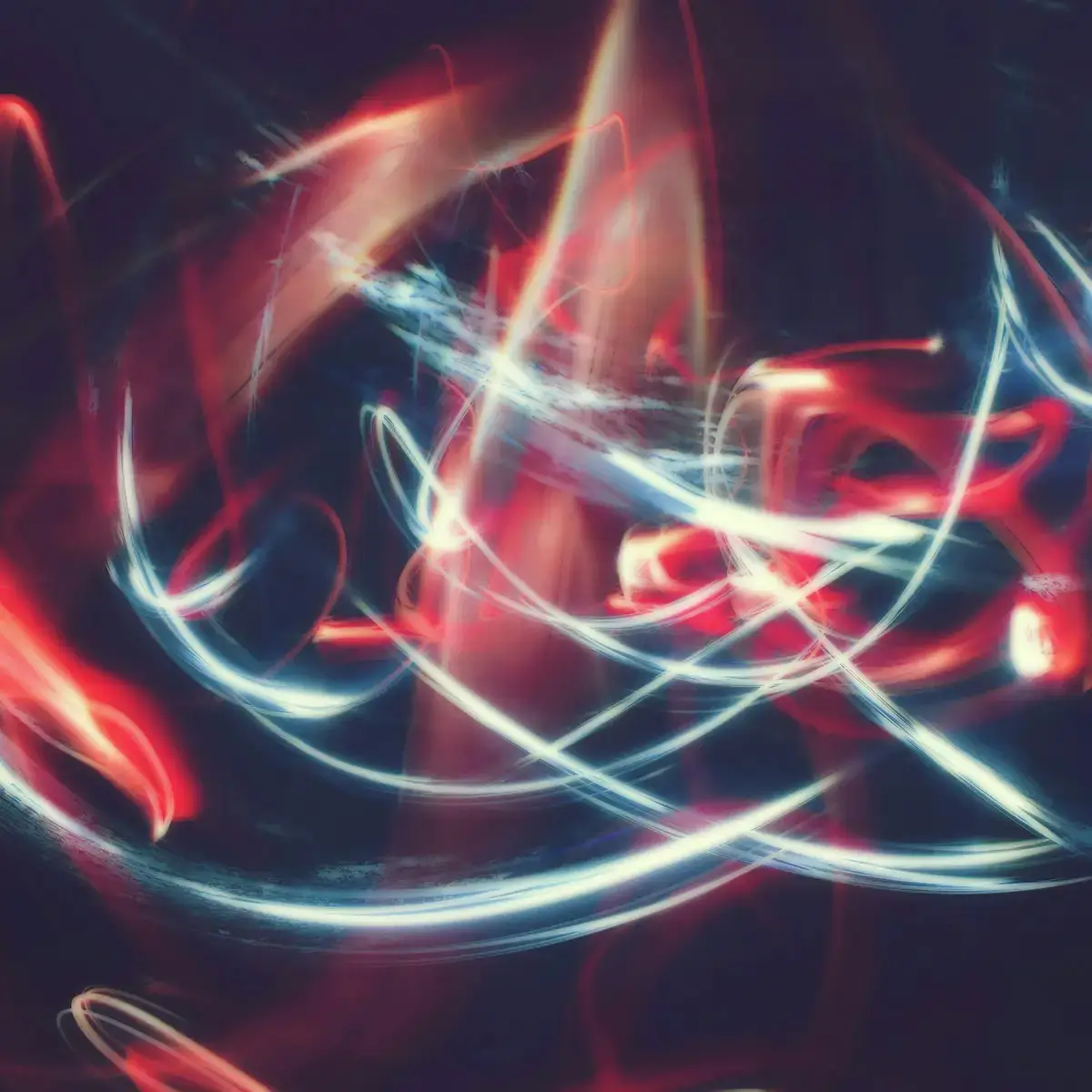 A hand is shown on a desk where someone is taking written notes